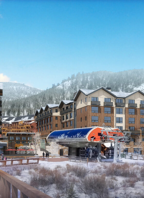 Ski resort village with gondola and snowy mountain backdrop