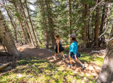 Two women hiking in the mountains Kindred Resort Keystone