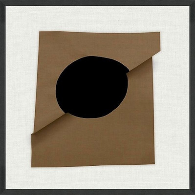 Minimal abstract artwork with black circular form on folded brown paper