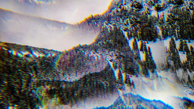 Snowy mountain landscape with mirrored reflection and chromatic distortion