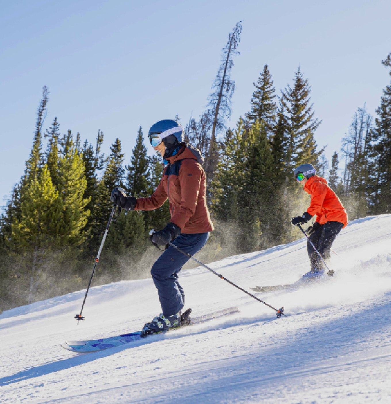 Couple Skiing down the hill Kindred Resort Keystone